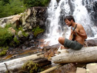 Jeff  Strumming by the waterfall. Photograph: courtesy Jeff Kagan
