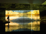 A lone sadhu watches the Video art from the live show of The Holiwater Project at the Nahagar Fort Kund, Jaipur, India 2007. Photograph: Andrei Jewell/Holiwater